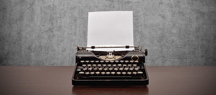 Person Using Vintage Typewriter as a Strategy to Prevent Ransomware Attacks